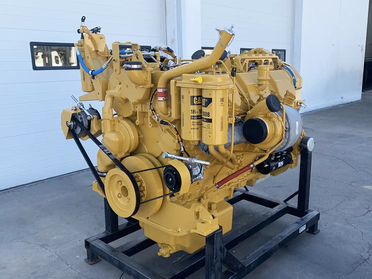 Rebuilt Caterpillar C27 engine for a D10T Dozer Tier 4 shown from the back left side.